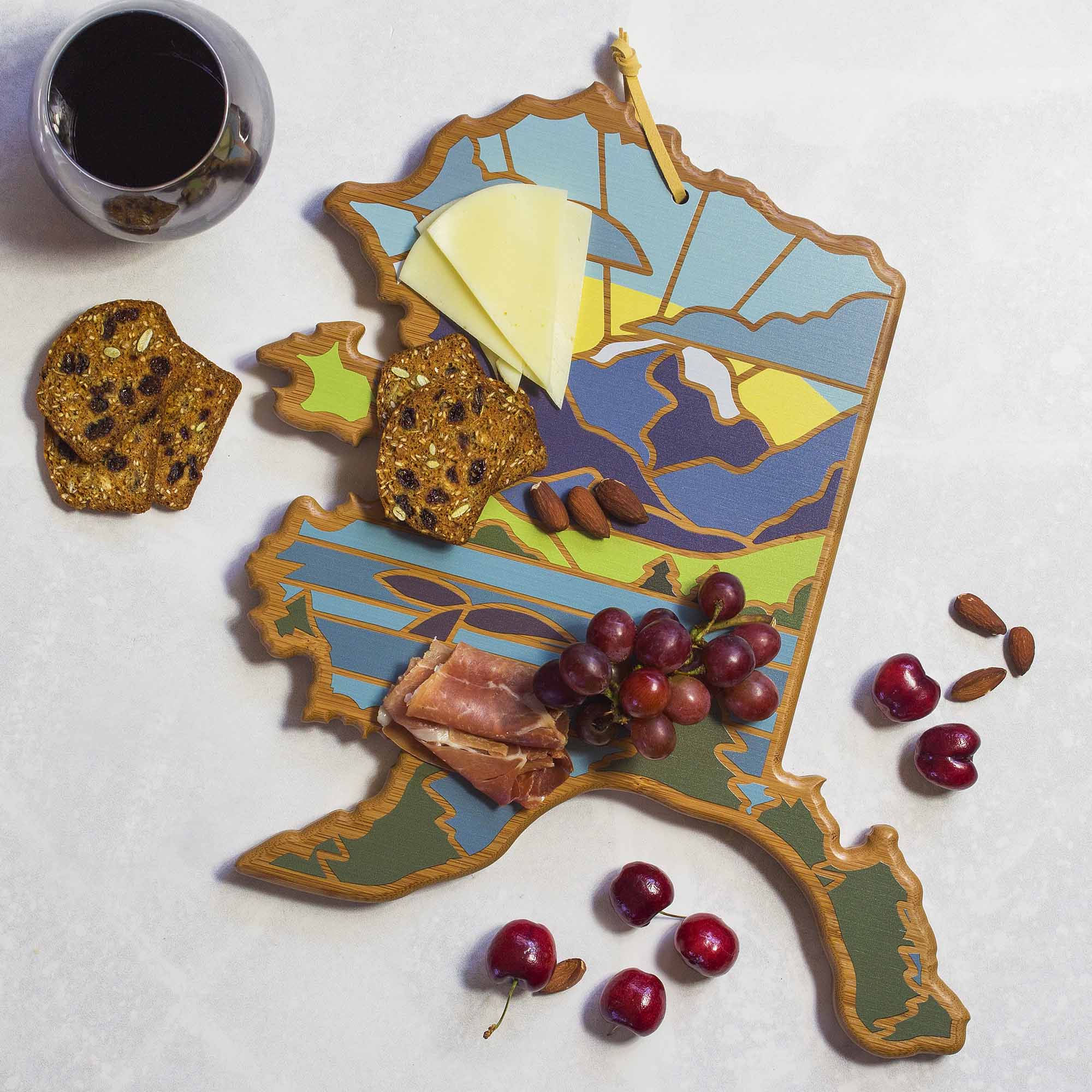 Angle. Totally Bamboo - Alaska Cutting Board with Artwork by Summer Stokes.