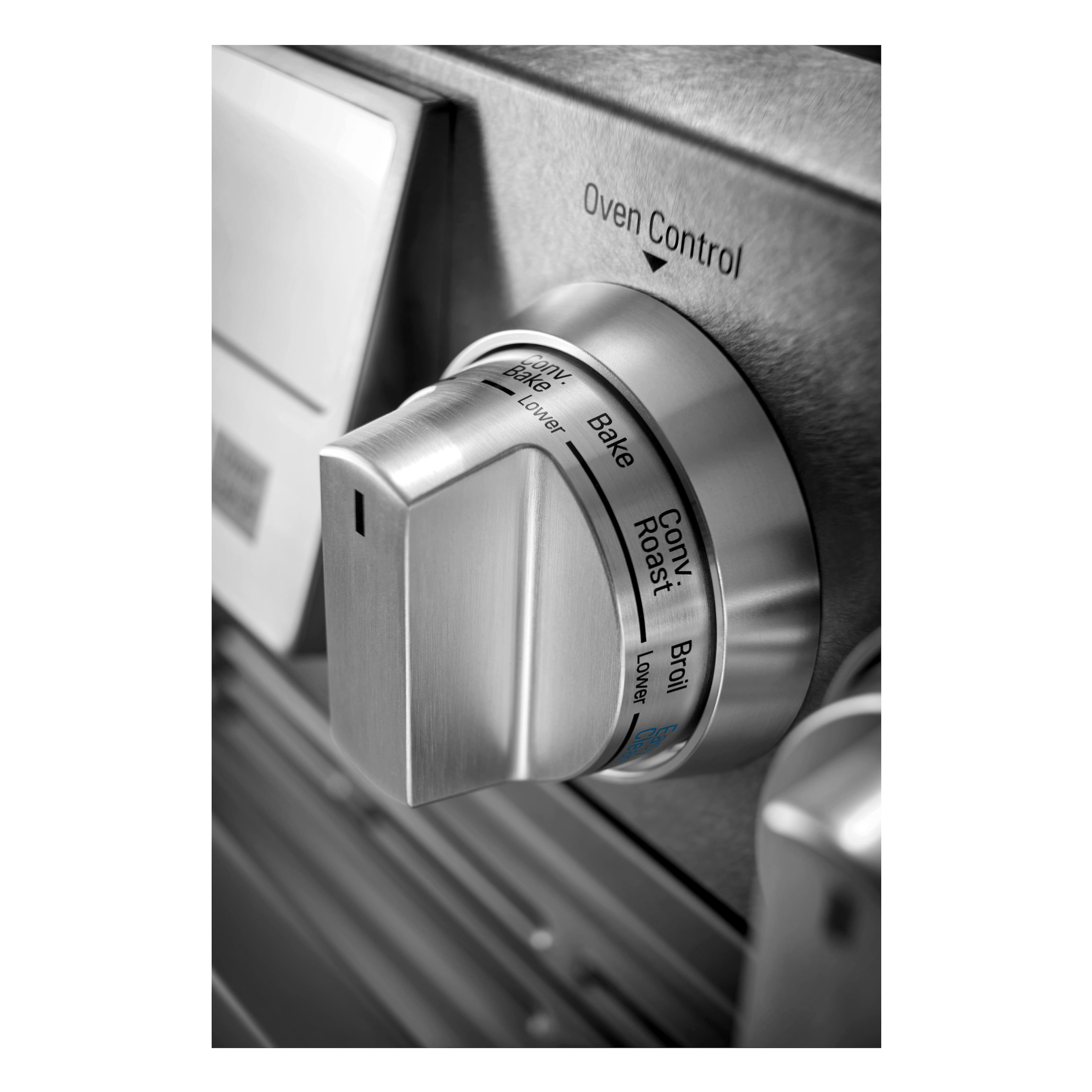 The text on the image reads "Oven Control Bake Conv. Lower Bake Roast Conv. Lower Broil 020 SI." This text is grouped as follows:
1. Oven Control: This refers to the control panel for the oven, which allows the user to adjust the settings and functions of the oven.
2. Bake Conv. Lower: This indicates that the oven is set to the lower bake setting, which is typically used for baking items that require a lower temperature.
3. Roast Conv. Lower: This refers to the lower roast setting, which is used for roasting items at a lower temperature than the higher roast setting.
4. Lower Broil: This is the lower broil setting, which is used for broiling items at a lower temperature than the higher broil setting.
5. 020 SI: This is likely a model number or a code that corresponds to the oven or appliance.