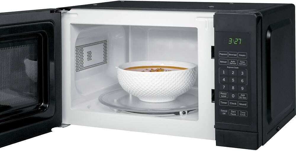 Angle. GE - 0.7 Cu. Ft. Spacemaker Countertop Microwave Oven - Black on Black.