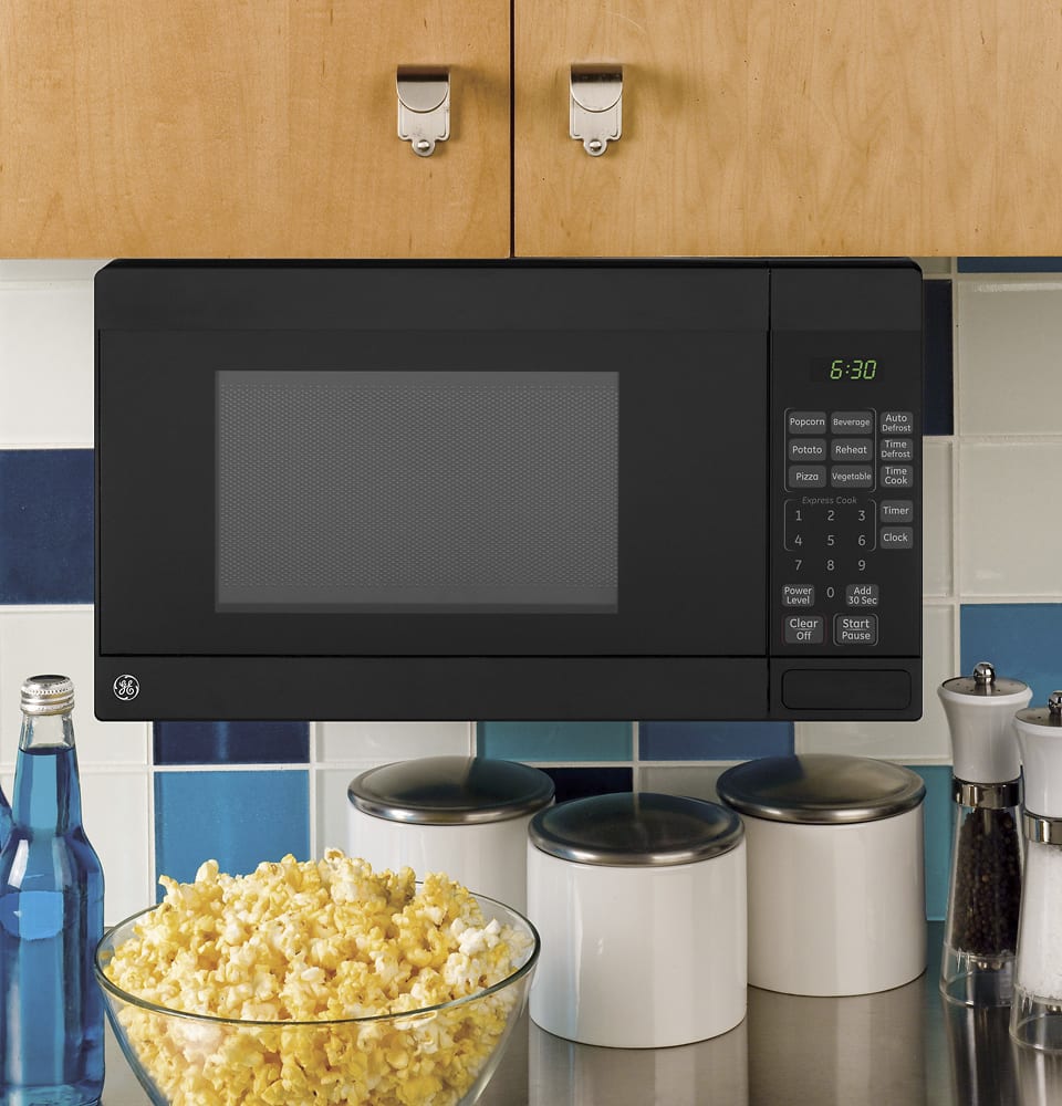 Alt View 12. GE - 0.7 Cu. Ft. Spacemaker Countertop Microwave Oven - Black on Black.