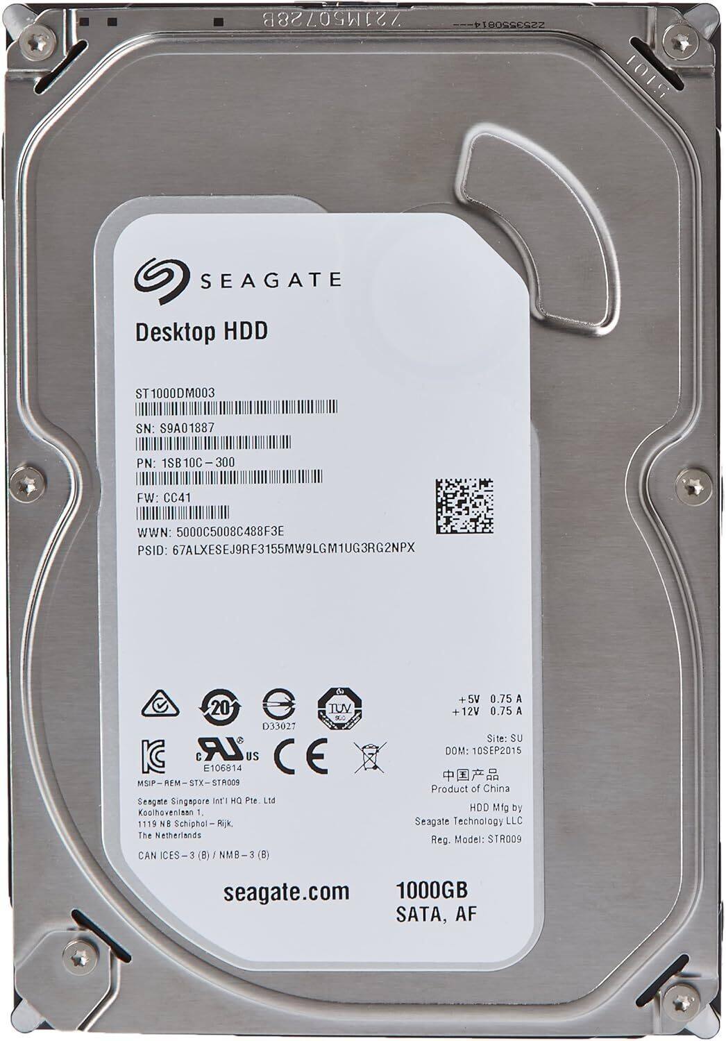 721M50728B /28B 253550814  
1015 SEAGATE Desktop HDD ST 1000DM003  
SN: S9A01887  
PN: 1SB 1SB10C-300  
FW: CC41  
WWN: 5000C5008C488F3E  
PSID: 67ALXESEJ9RF3155MW9LGM1UG3RG2NPX  
C 20 e TUV SLO D33027 IC LR US CE E106814  
MSIP-REM-STX-STR009  
MSIP STX STR009  
Seagate Singapore Int'l Pte Ltd  
Koolhovenlaan 1, 1119 NB Schiphol-Rijk, The Netherlands  
CAN 3 NMB 3 (B)  
+5V 0.75 A  
+12V 0.75 A  
Site: SU  
DOM: 10SEP2015  
Product