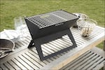 Angle. Fire Sense - Notebook Charcoal Grill - Black.