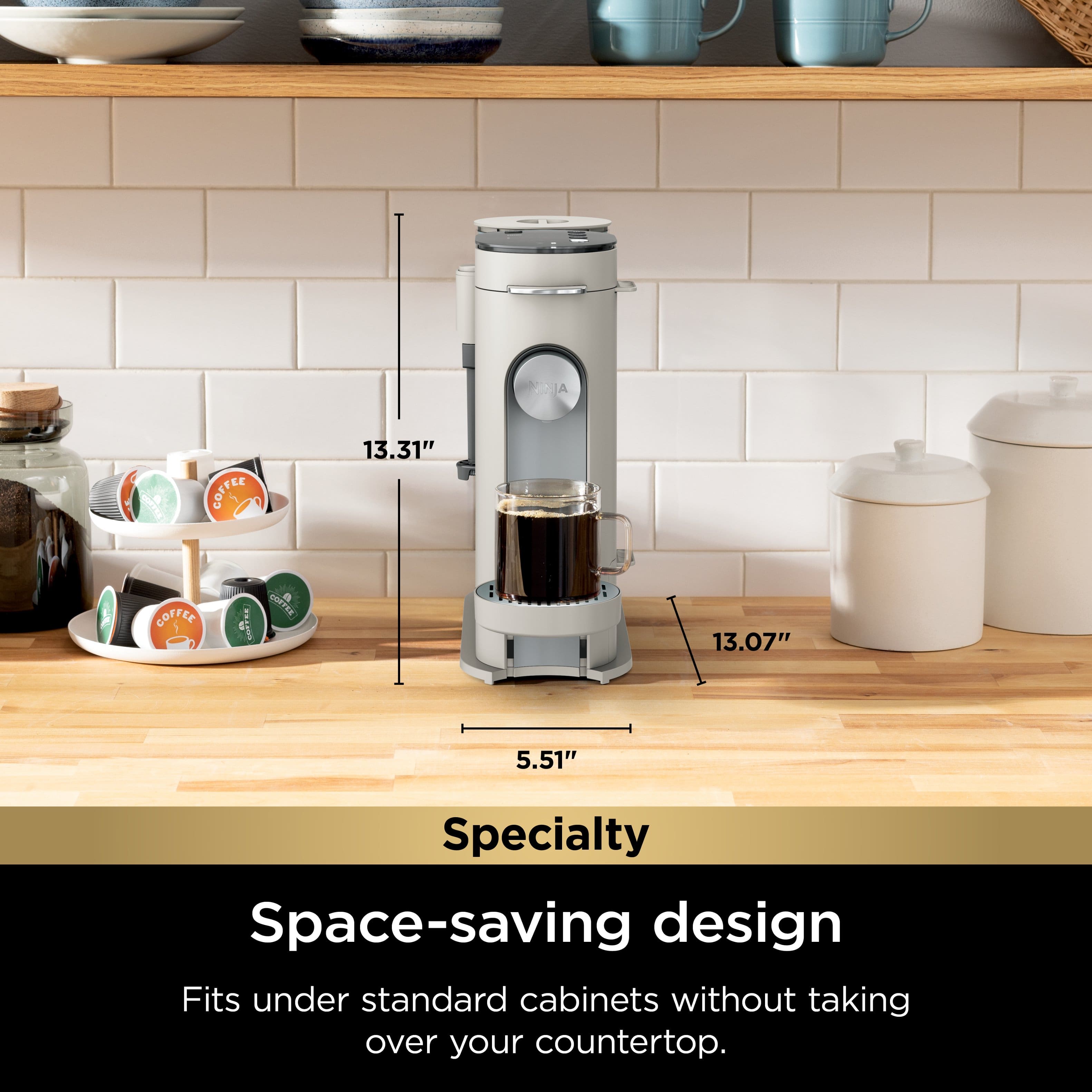 The text on the image reads: "JA FasaOo COFFEE 13.31" COFFEE o Sd a Thaaun 13.07" 5.51" Specialty Space-saving design Fits under standard cabinets without taking over your countertop."