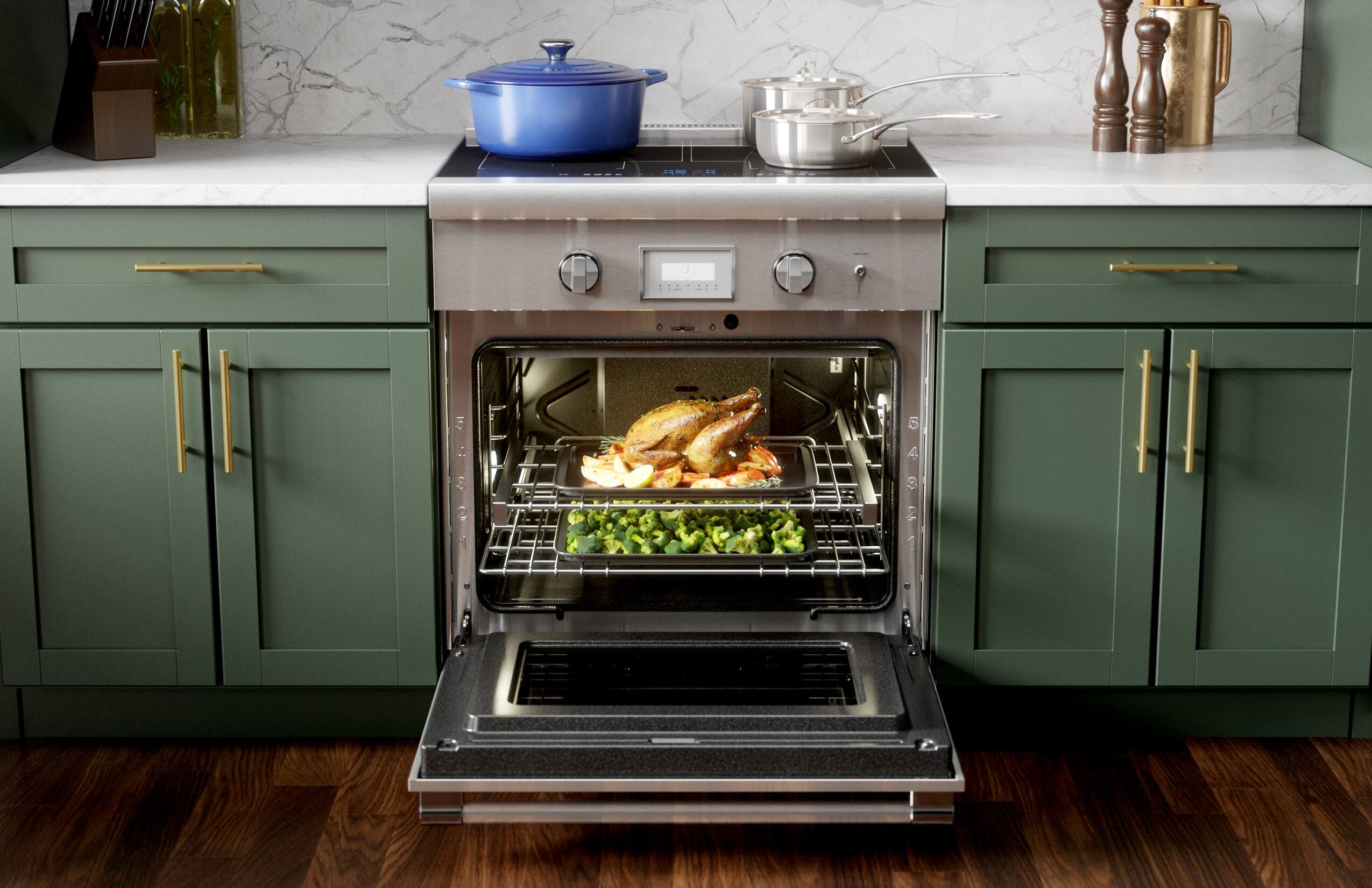 The image shows a kitchen with a stove top oven. The oven is open, revealing a turkey and some broccoli inside. The turkey is placed on a rack, and the broccoli is positioned below it. The oven is filled with food, indicating that it is being used for cooking. The kitchen also features a sink, and there are several bottles placed nearby.