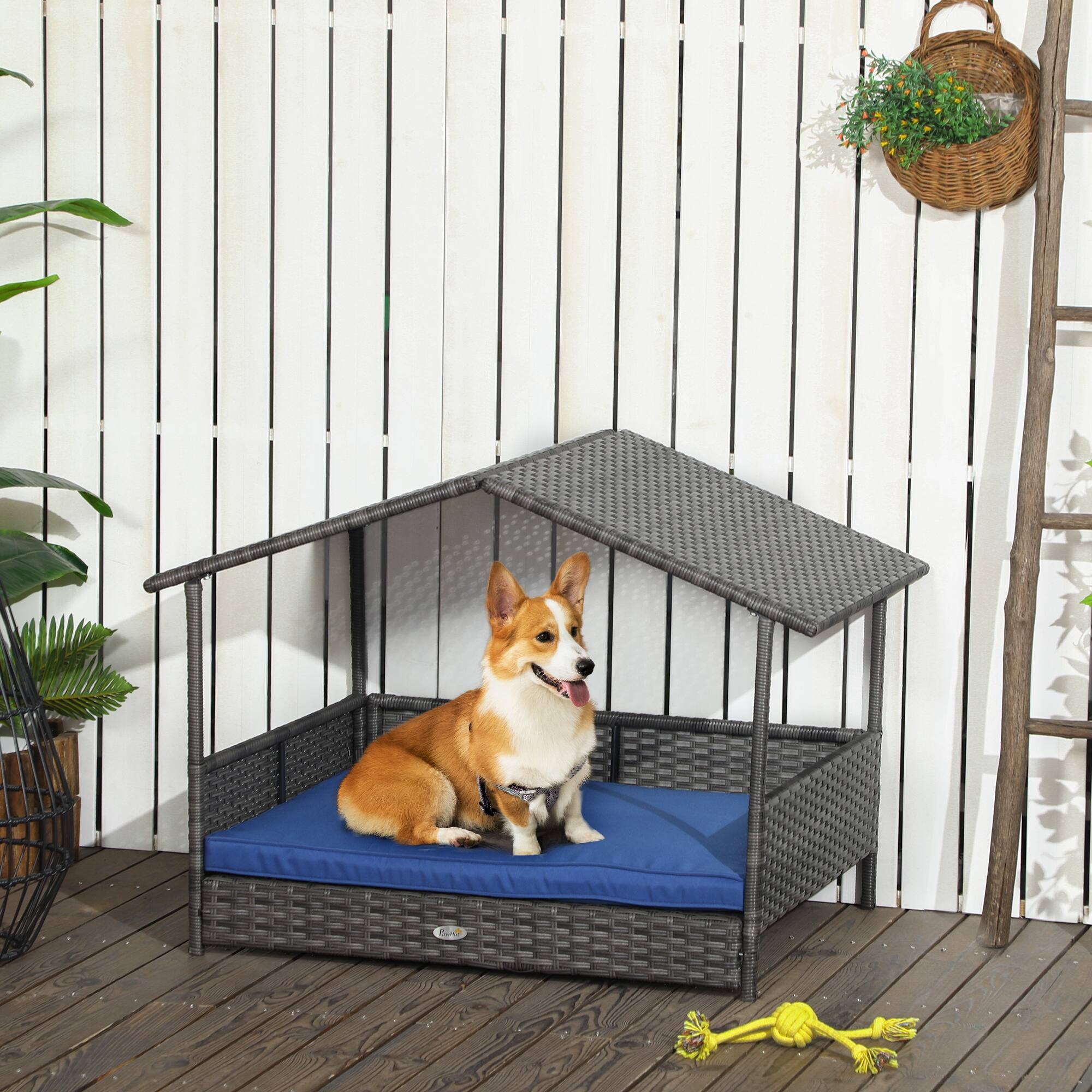 Angle. Pawhut - Wicker Dog House Outdoor, Canopy, Rattan Bed, Water-resistant Cushion, 66 lbs, 19.75", Gray Wicker, Dark Blue Cushion - Blue.