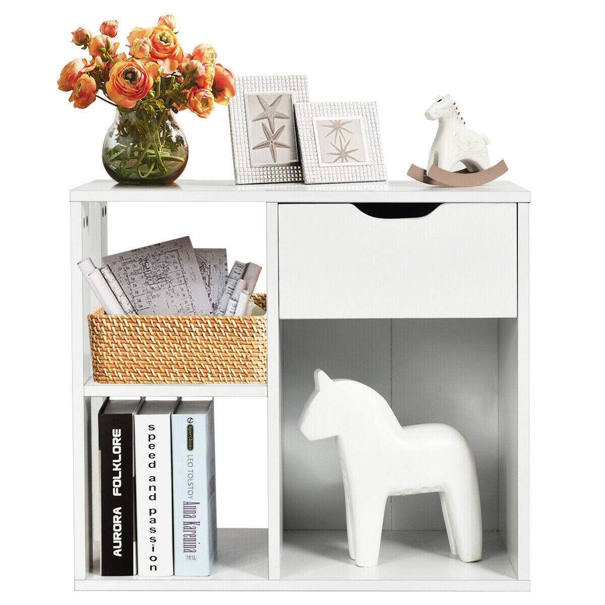 The image features a white table with various items on it. There is a white horse figurine, a basket of books, a vase with flowers, and a small horse statue. The books are arranged in a stack, and there is also a small horse figurine on the table. The table is a part of a shelf, and the items on it create a visually appealing and organized display.