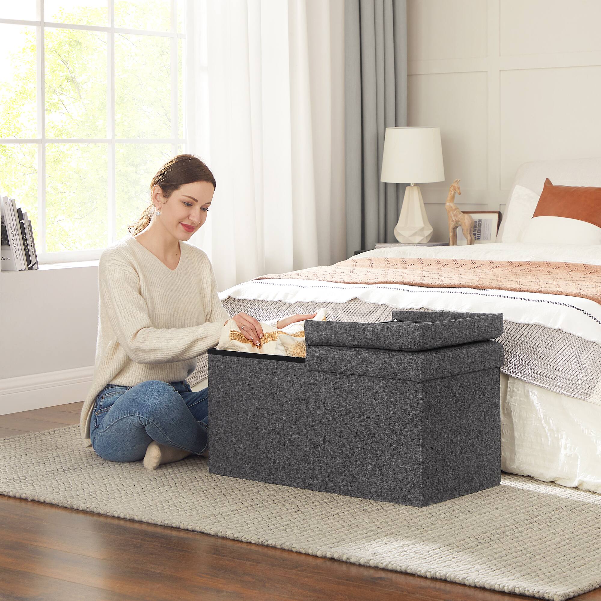 Angle. Songmics Home - 21.1-Gal Storage Ottoman Bench, Folding Storage Chest, Footstool with Flip-Up Lid, Padded Seat,Up to 660 lb - Dark Gray.