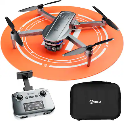 The image features a remote control drone with a camera on top of it, sitting on an orange circle. The drone is surrounded by a few other objects, including a black case, a black box, and a black bag. The drone is equipped with GPS technology and is ready to fly. The image also includes a clock, which is placed near the drone.