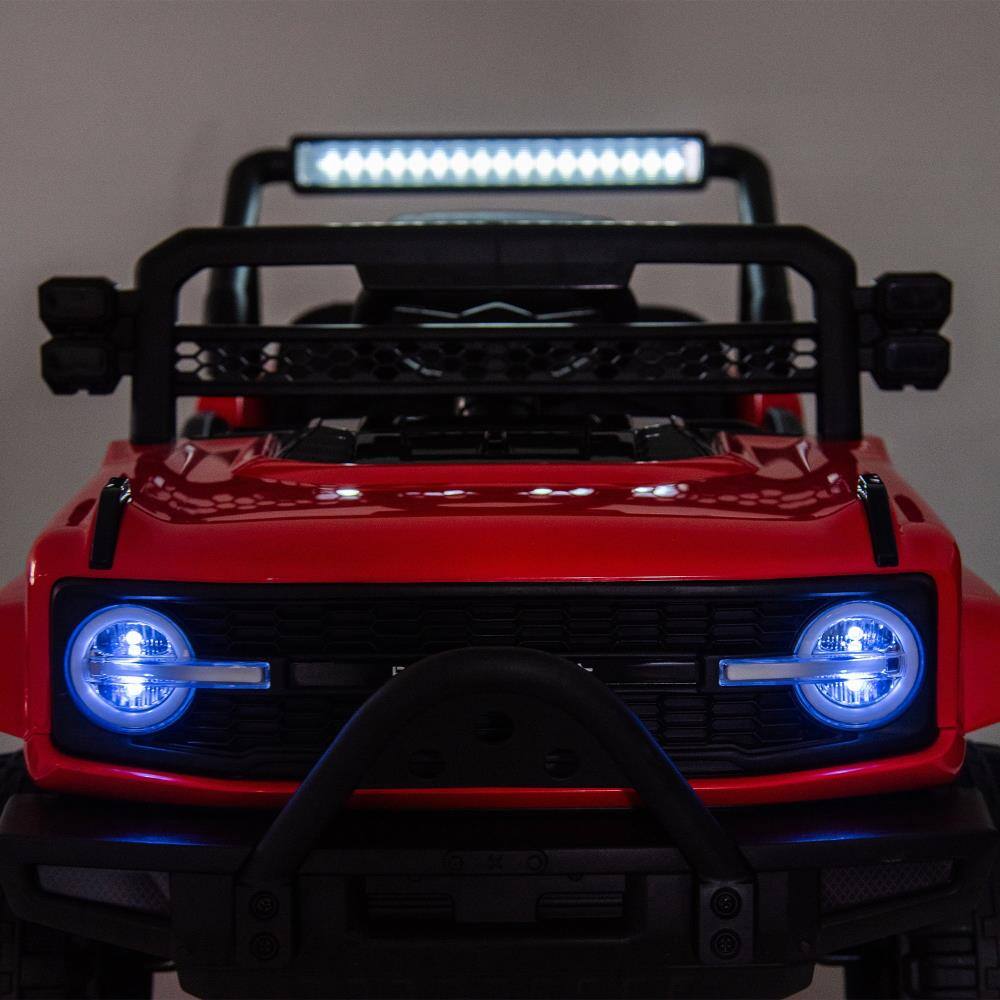 Angle. BreeBe - 12V Kids 6-Wheel Electric Truck with Parental Control, Six-Wheel Suspension, 4 Motors, LED Lights, Music, Ages 3-5 - Red.