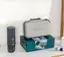 Outlin is a company that sells various products, including a box that contains a laptop, a cell phone, and a coffee mug. The box is sitting on a table next to a coffee mug.