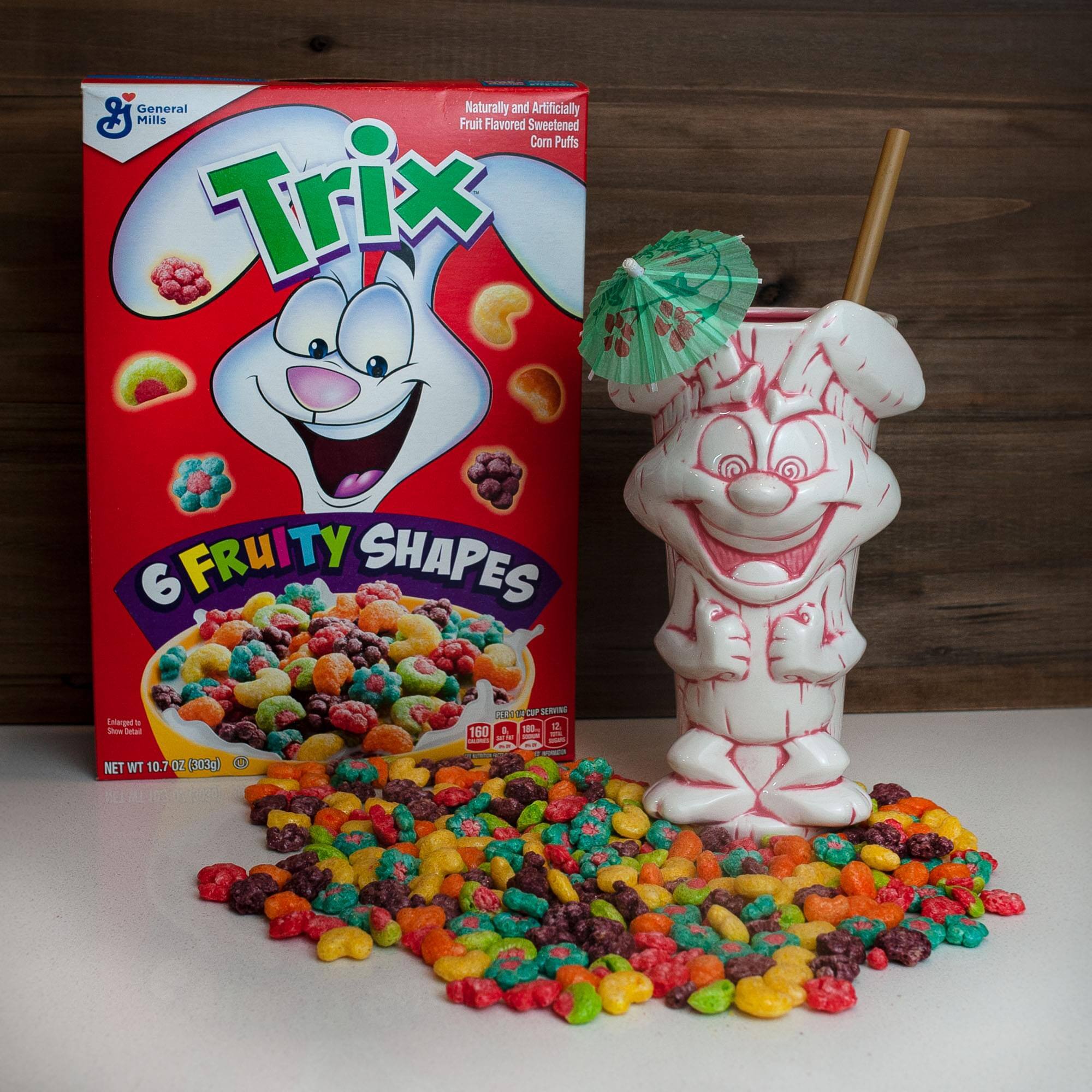 General Mills Fruit Flavored Sweetened Corn Puffs Trix 6 FRUITY SHAPES  
NET WT 10.7 OZ (303g)  
1 SERVING - 160 CALORIES