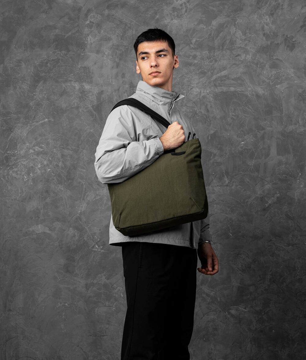 Angle. ALPAKA - Flight Tote (M) Laptop Tote Bag for Work, Tote Bag Fits 14" MacBook Pro, Water Bottle Pocket, Luggage Pass-Through - Green Axoflux 400D.