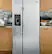 Left. GE - 23.0 Cu. Ft. Side-by-Side Refrigerator with External Ice & Water Dispenser - Stainless Steel.