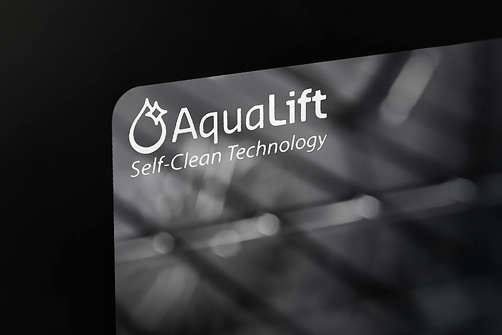 The largest text in the image reads "AquaLift Technology Self-Clean." This text is displayed on a black background, with a white and blue logo in the background. The image is likely promoting a self-cleaning technology, possibly related to gas ranges or other appliances.