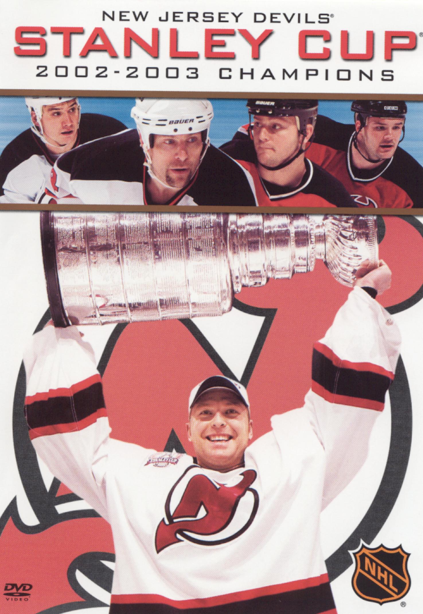 The 2003 Stanley Cup Champion New Jersey Devils pose for a team photo after  a ceremony honoring the 20-year anniversary before an NHL hockey game  against the Philadelphia Flyers, Saturday, Feb. 25