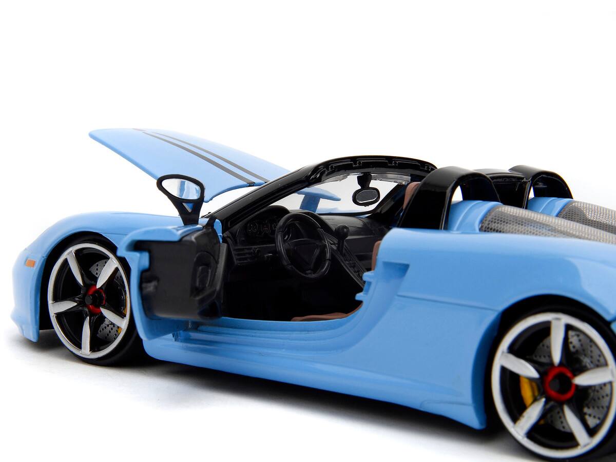 Left. Jada - Porsche Carrera GT Convertible Blue with Black Stripes "Pink Slips" Series 1/24 - Blue and Black.