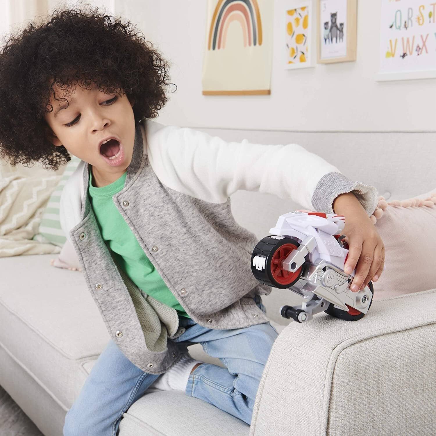 Left. Paw Patrol - Paw Patrol Wildcat Deluxe Pull-Back Motorcycle Vehicle with Wheelie Feature and Figure, Ages 3+ - Multicolor.