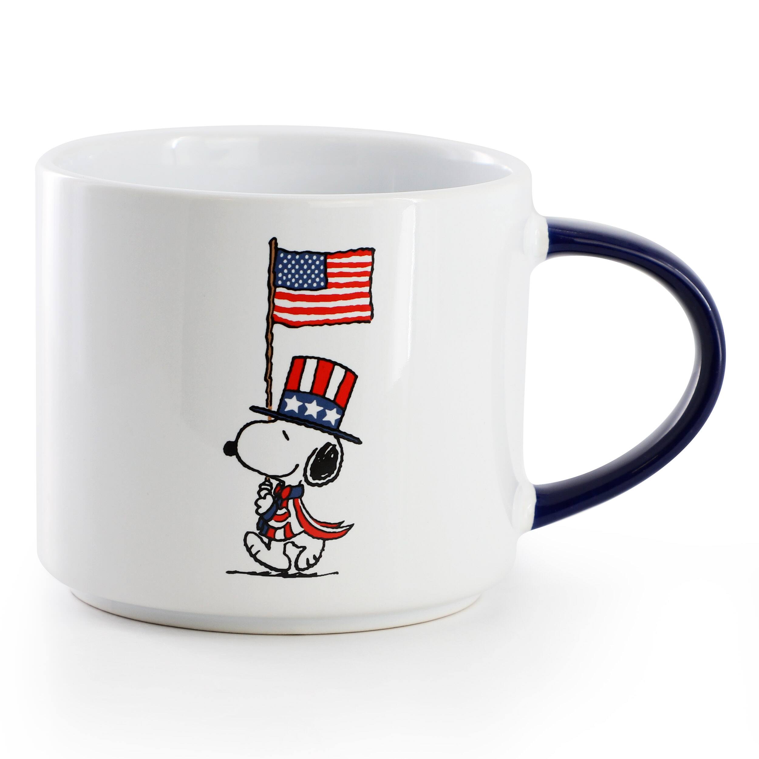 Angle. Peanuts - Peanuts Raise the Flag 4 Piece 15 Ounce Stoneware Mug Set in White, Blue, and Red - White, Blue, Red.