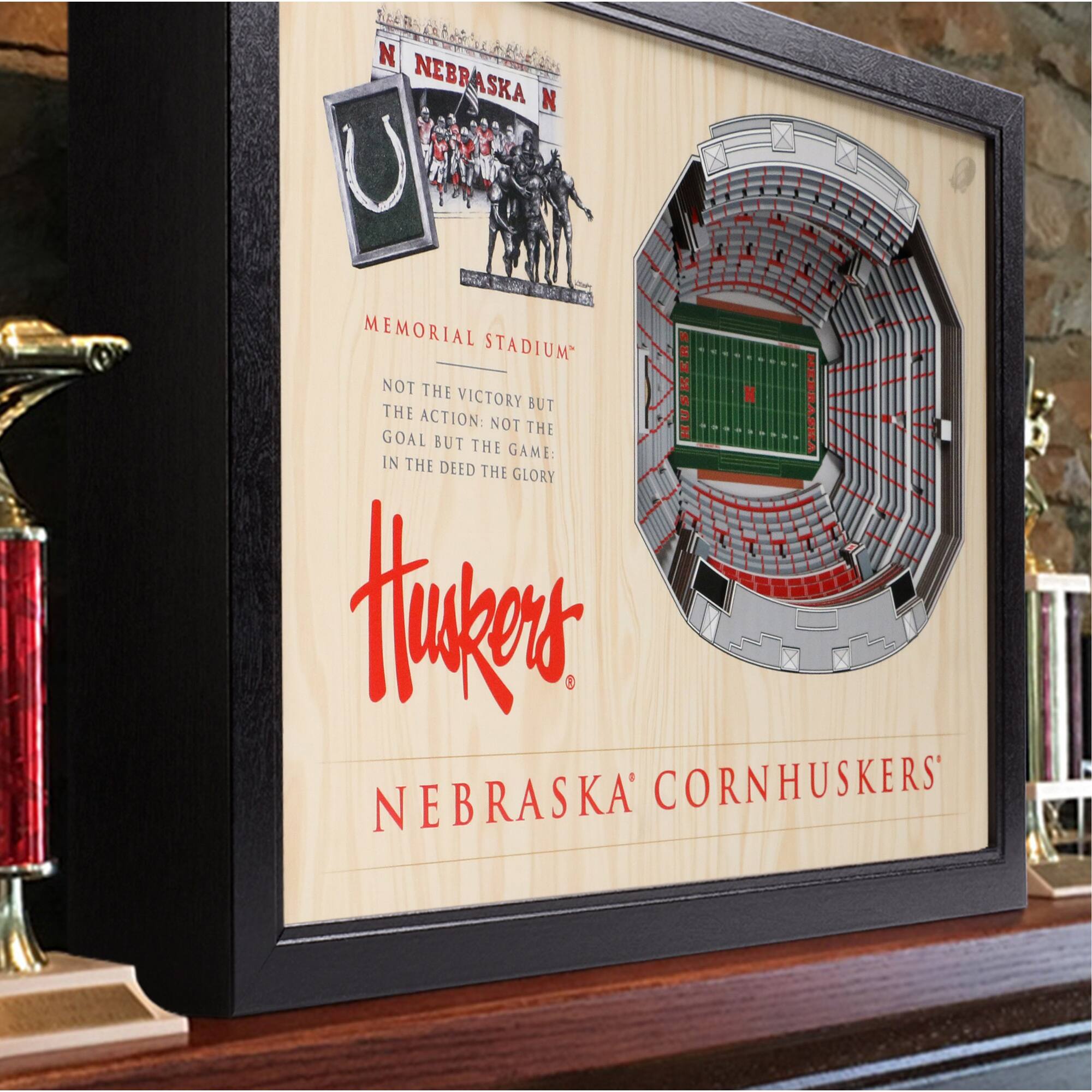 NEBRASKA  
MEMORIAL STADIUM  
NOT THE VICTORY BUT THE ACTION: NOT THE GOAL BUT THE GAME: IN THE DEED THE GLORY  

Huskers  
NEBRASKA CORNHUSKERS