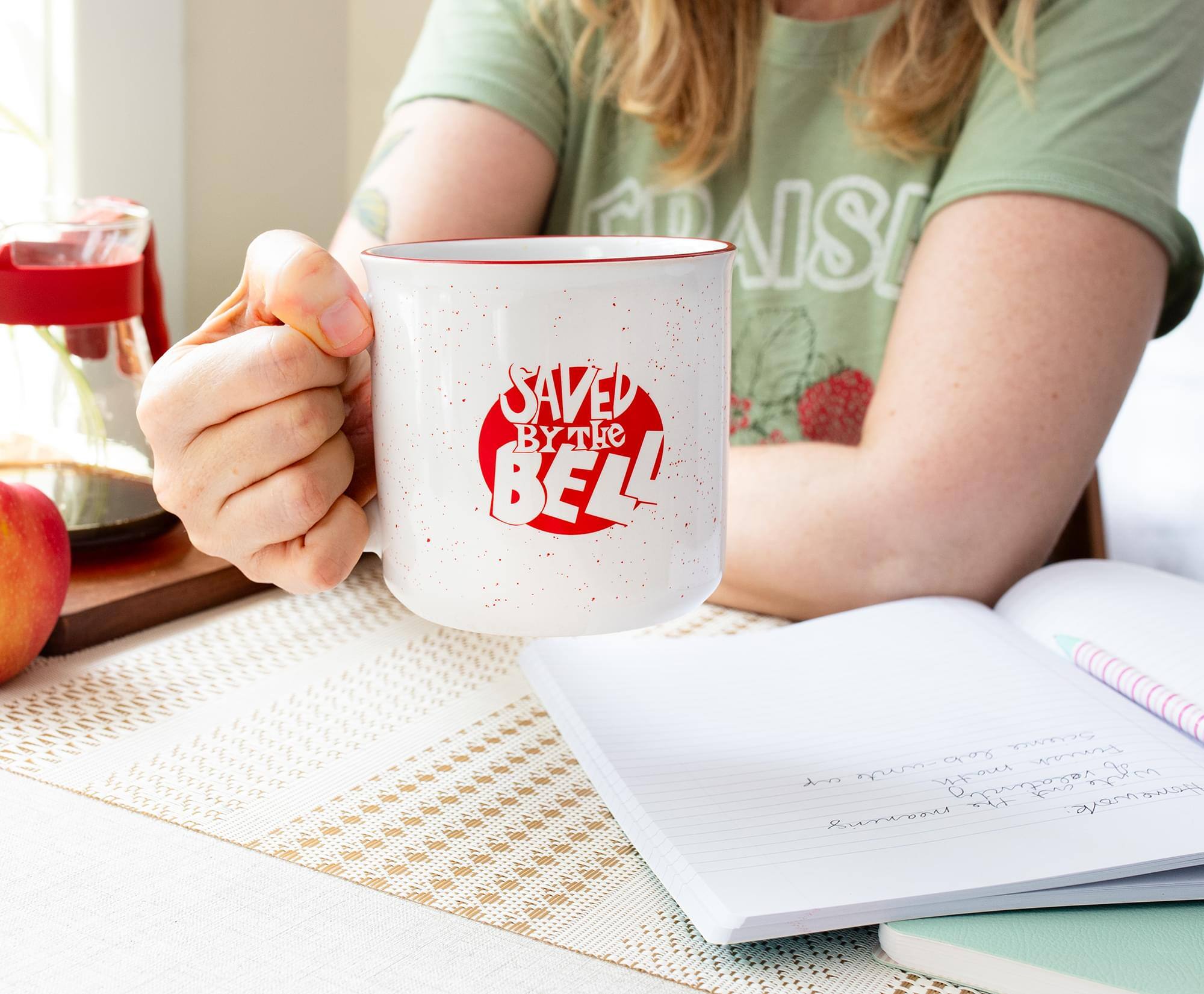 Sure, here is the corrected text:

"PAISI SAVED BY THE BELL"

The text on the mug reads: "SAVED BY THE BELL"