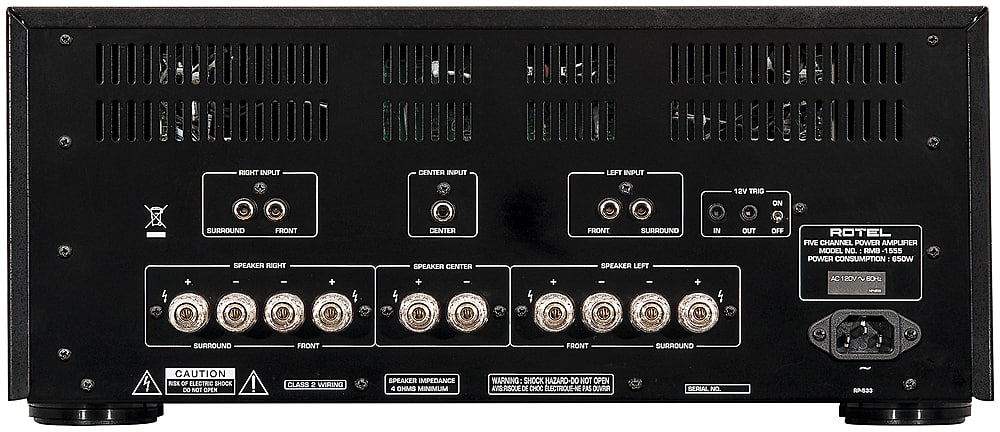 The text on the image reads:
"RIGHT INPUT CENTER INPUT LEFT INPUT 12V TRI ON + SURROUND FRONT SPEAKER RIGHT I - CENTER SPEAKER CENTER + i + FRONT SURROUND SPEAKER LEFT - + IN OUT OFF ROTEL FIVE CHANNEL POWER AMPLIFIER MODEL NO. : RMB A 555 POWER CONSUMPTION 650W AC120V 80HL SURROUND FRONT FRONT SURROUND 4 CAUTION RISK OF ELECTRIC SHOCK DO NOT OPEN ! CLASS 2 WIRING SPEAKER IMPEDANCE 8 OHME MINIMUM WARNING: SHOCK HAZARD-DO NOT OPEN."
