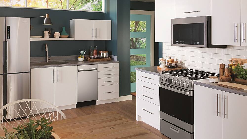 Left. Haier - 1.4 Cu. Ft. Over-the-Range Microwave with Sensor Cooking - Stainless Steel.