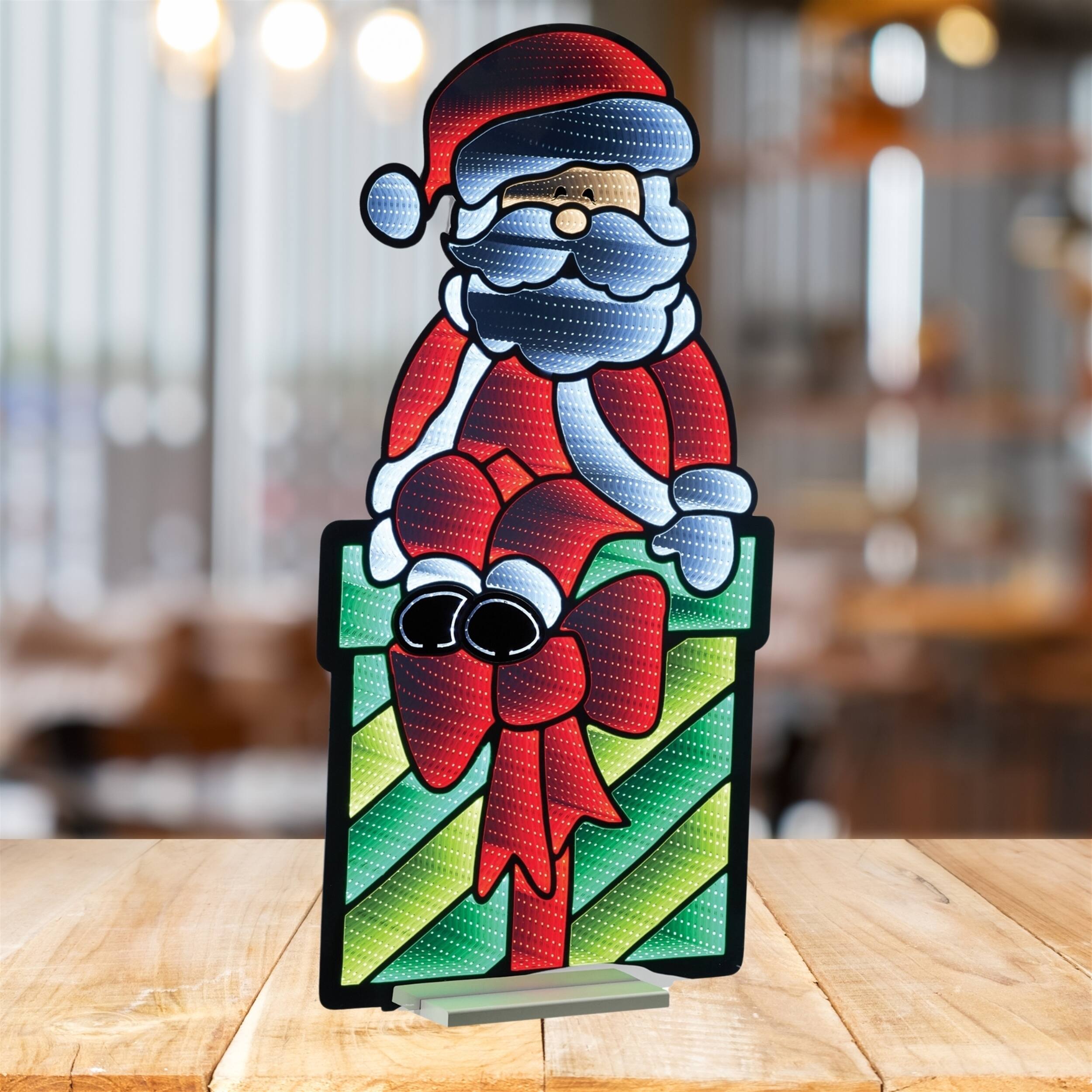 Left. BreeBe - Santa on Package Ekkolight 47"H - Red, White, Green.