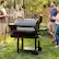 Angle. Z GRILLS - Powerhouse 1056 sq. in. Pellet Grill and Smoker with Foldable Front Shelf and Rain Cover - Black.