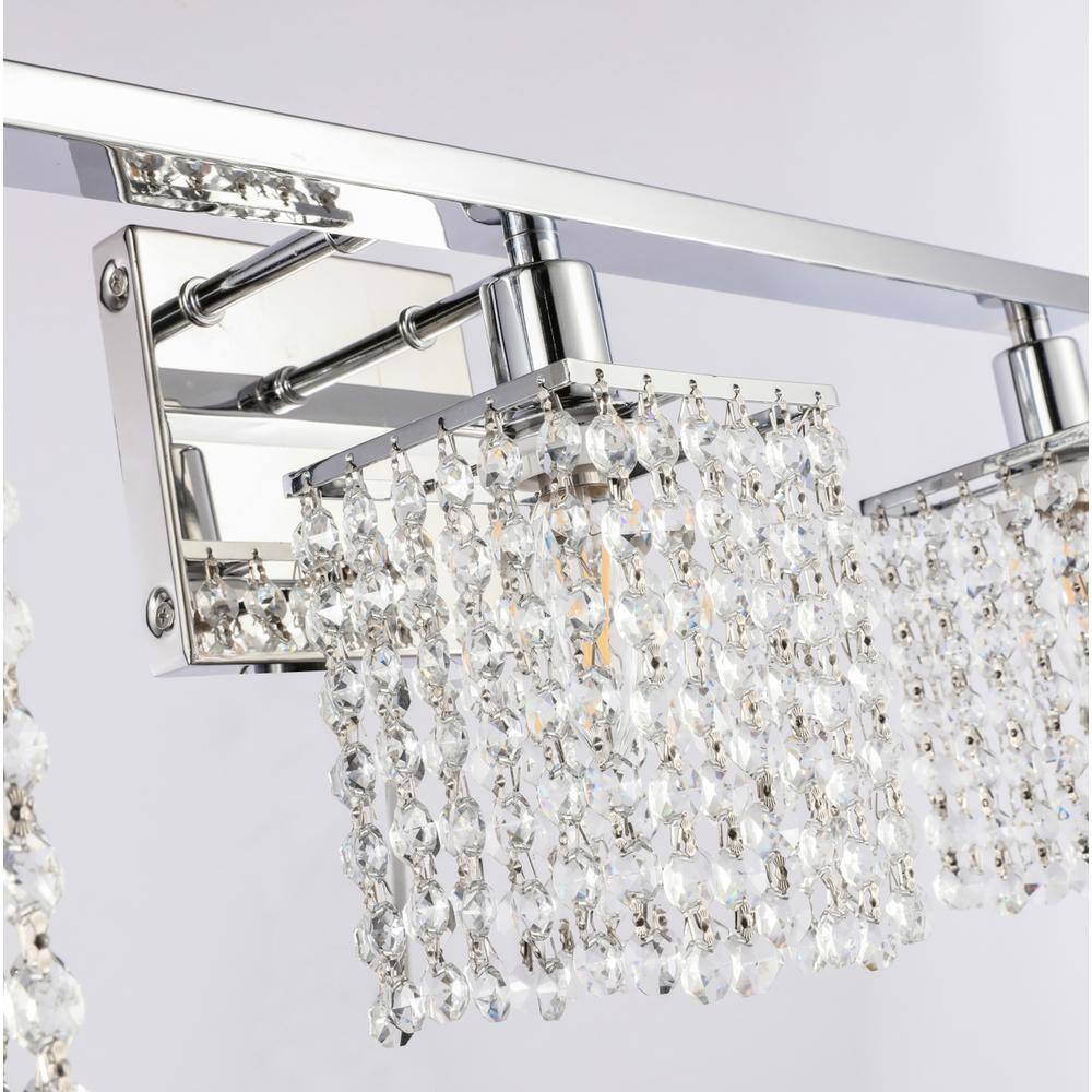 Left. Living District - Phineas 3 light Chrome and Clear Crystals wall sconce - Chrome And Clear Crystals.