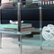 Alt View Zoom 11. Walker Edison - Wave Modern Metal and Glass Coffee Table - Clear.