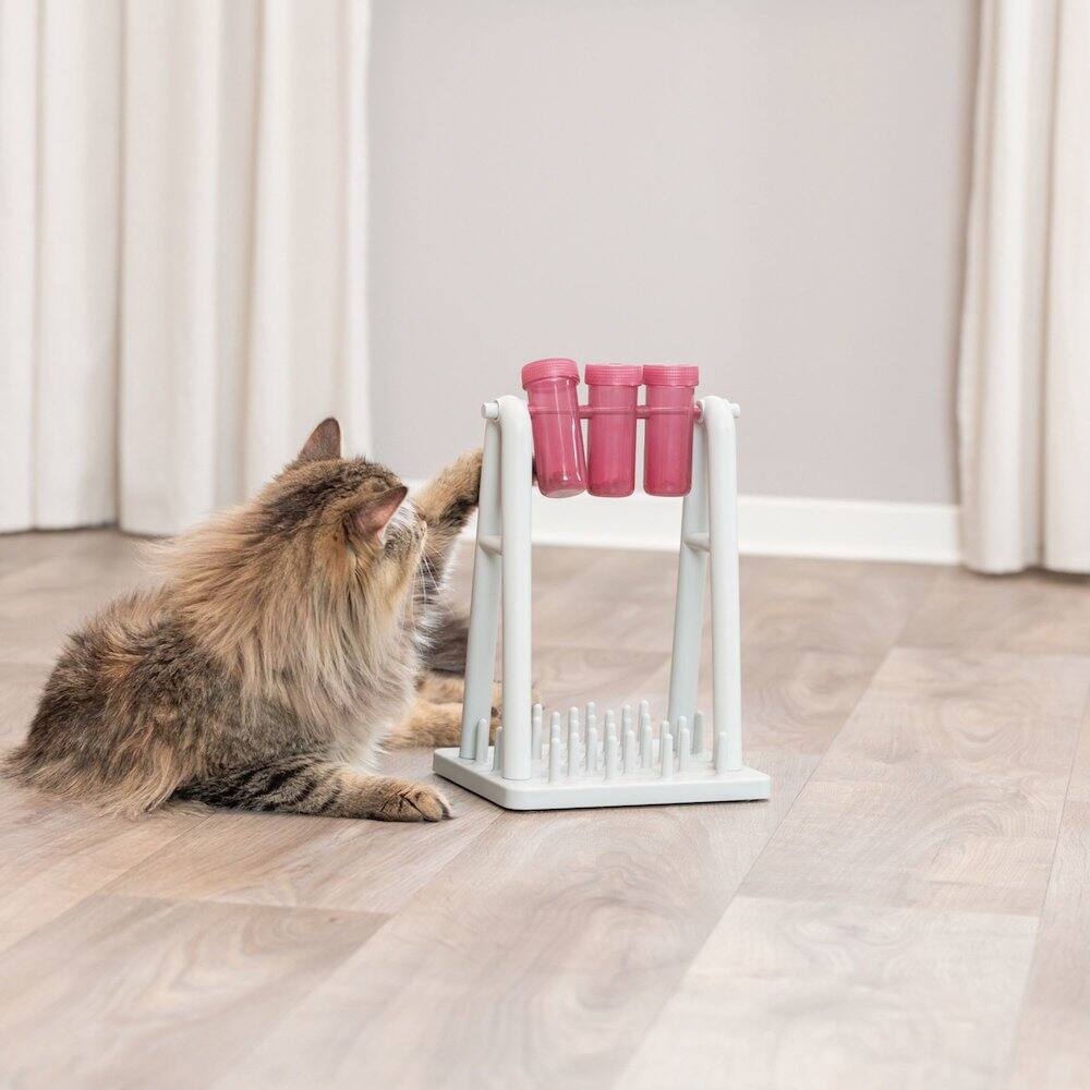 Left. TRIXIE - Mad Scientist Turn Around Strategy Game Cat Puzzle Toy, Treat Dispenser - White/Pink.