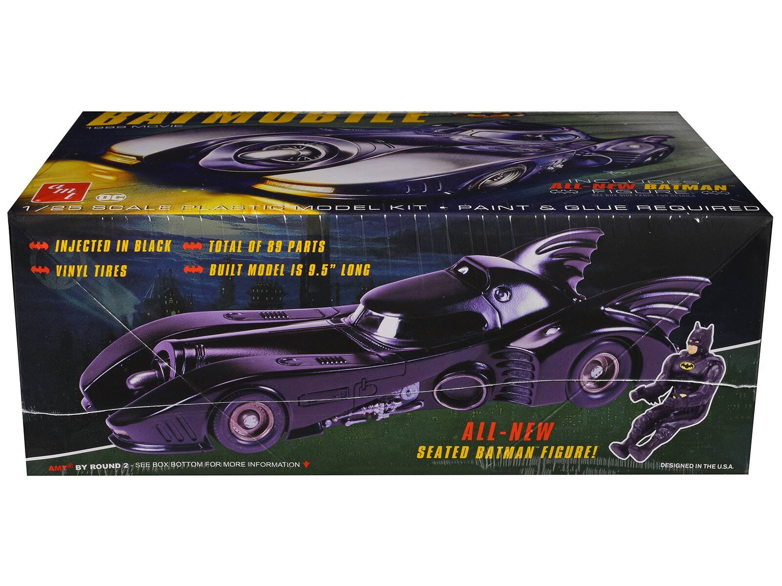 BATMOBILE MOVIE 1/85 SCALE PLASTIC MODEL KIT - PAINT & GLUE REQUIRED  
INJECTED IN BLACK VINYL TIRES  
TOTAL OF 89 PARTS  
BUILT MODEL IS 9.5" LONG  
ALL-NEW SEATED BATMAN FIGURE!  
DESIGNED IN THE U.S.A.