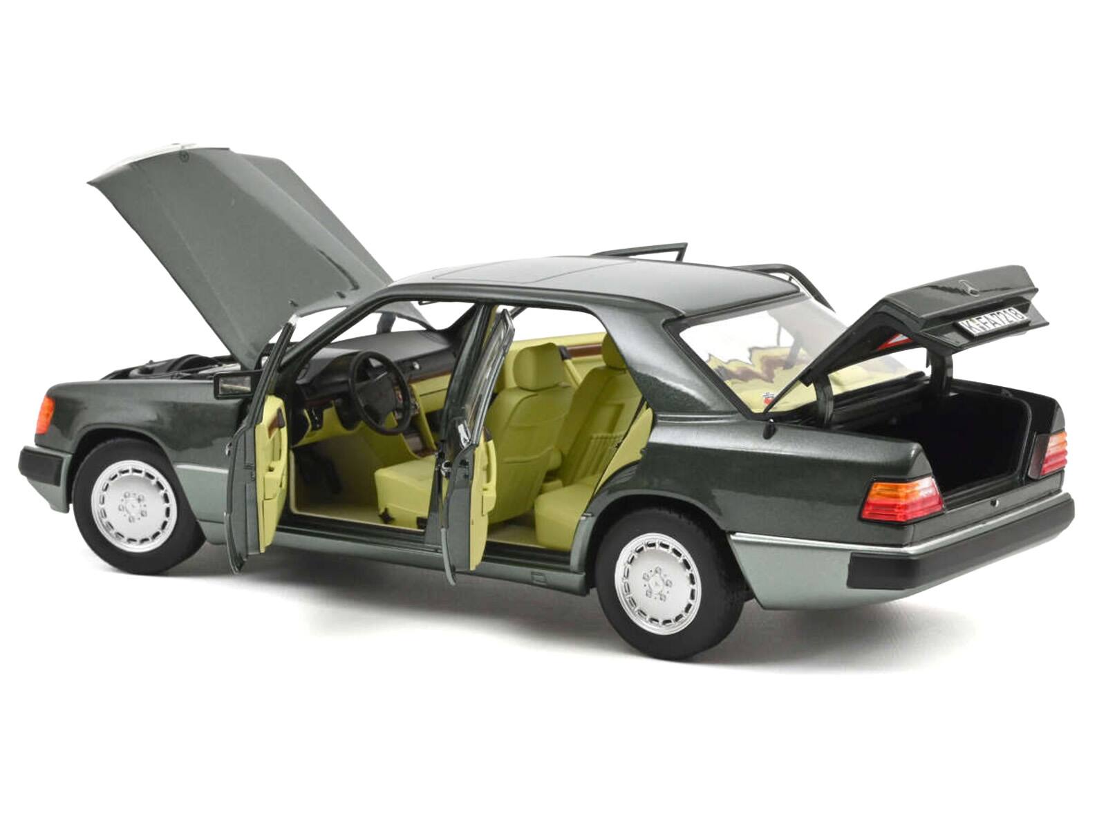 Alt View 1. Norev - 1990 Mercedes-Benz 230 E Night Green Metallic with Green Interior 1/18 Diecast Model by Norev.