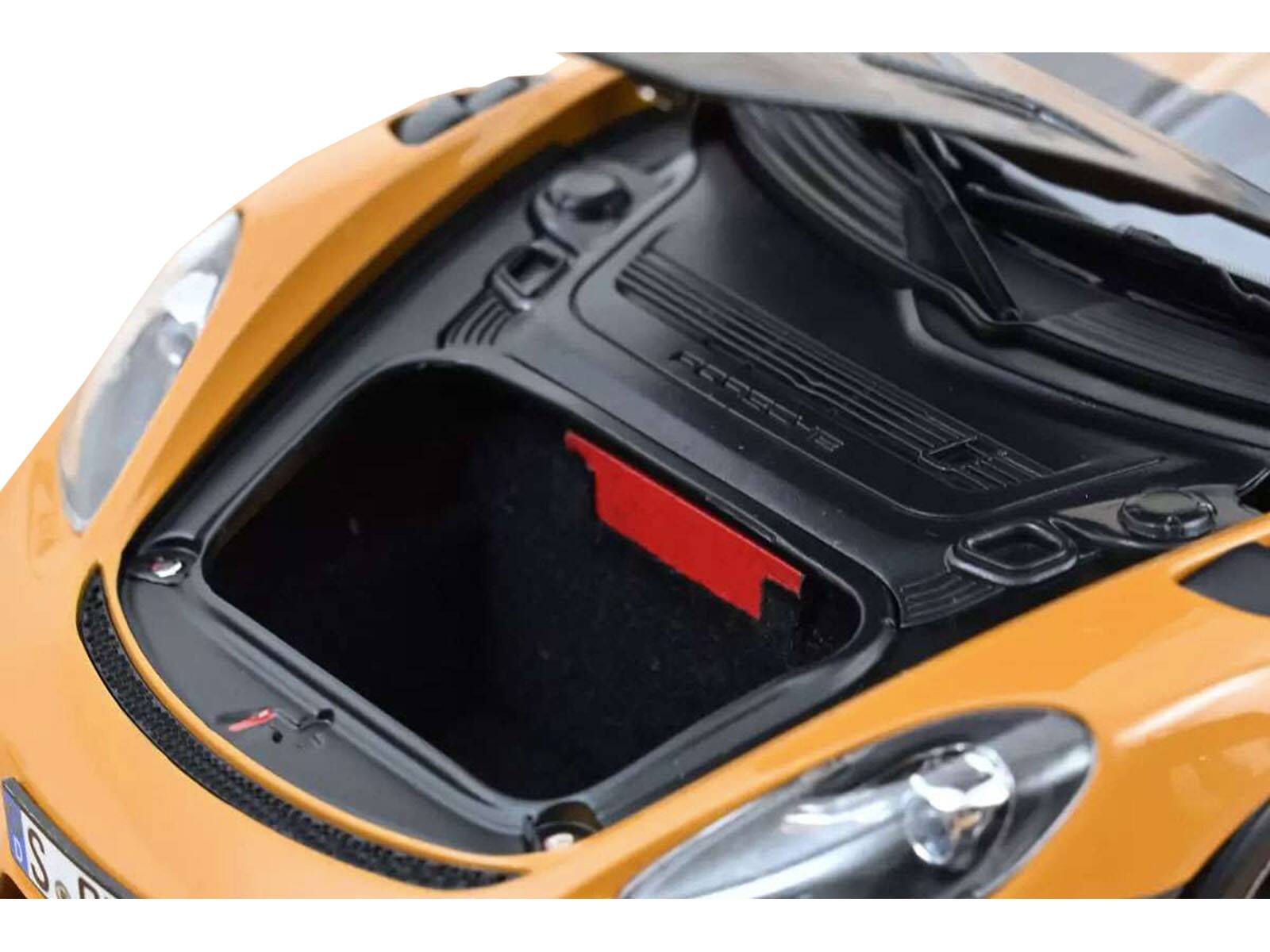 Left. Norev - 2023 Porsche Cayman GT4 RS Weissach Pack Bahama Yellow with Carbon Hood 1/18 Diecast Model Car by Norev - Yellow.