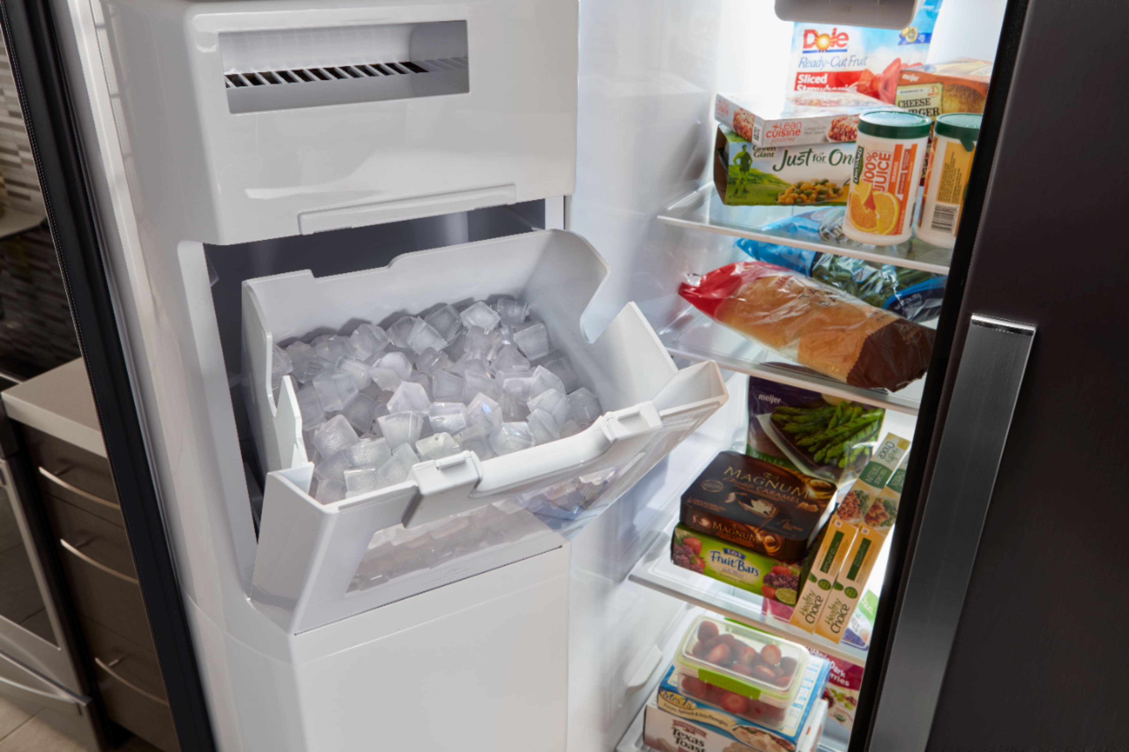 The image features a full-size refrigerator with a water dispenser on the door. The water dispenser has a 3-ounce dispense unit and offers options for ice type, temperature, and measured lock. The dispenser also has a light that indicates when it is on or dim, and it can dispense cubed or crushed ice. The refrigerator is equipped with a back unit that allows for easy access to the water dispenser.