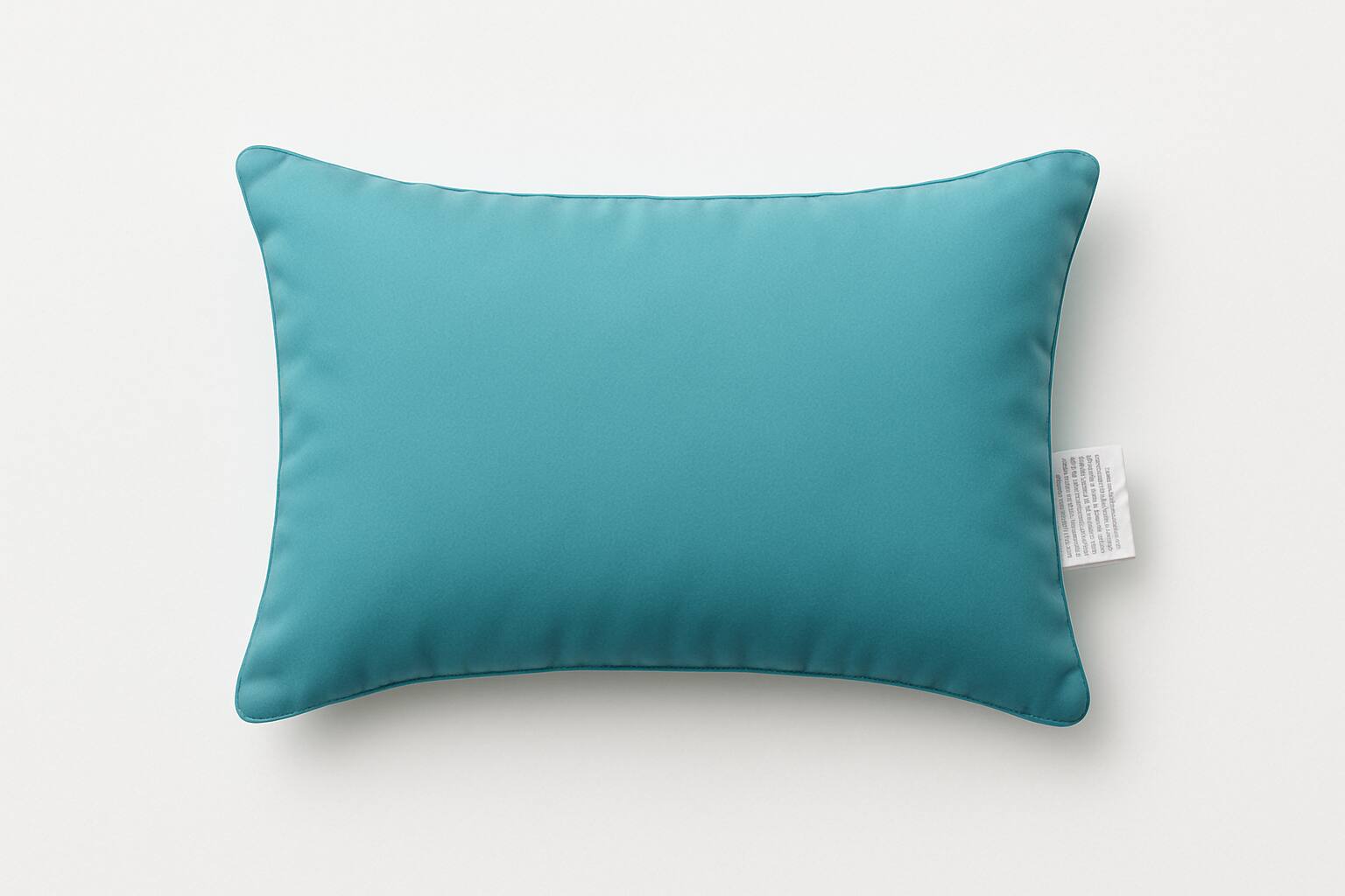 The text on the image is not clear enough to read accurately. However, based on the context, it seems to be a label or tag on the pillow. If you can provide a clearer image or more context, I might be able to help better.