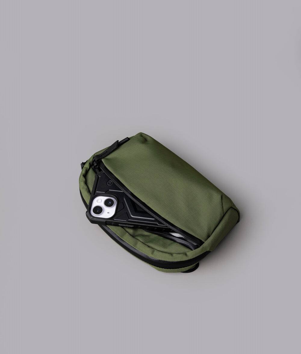 Alt View 9. ALPAKA - Flight Sling 1L Lightweight Crossbody Phone Bag for Travel, Passport Pocket, Weather-Resistant - Green Axoflux 210D.