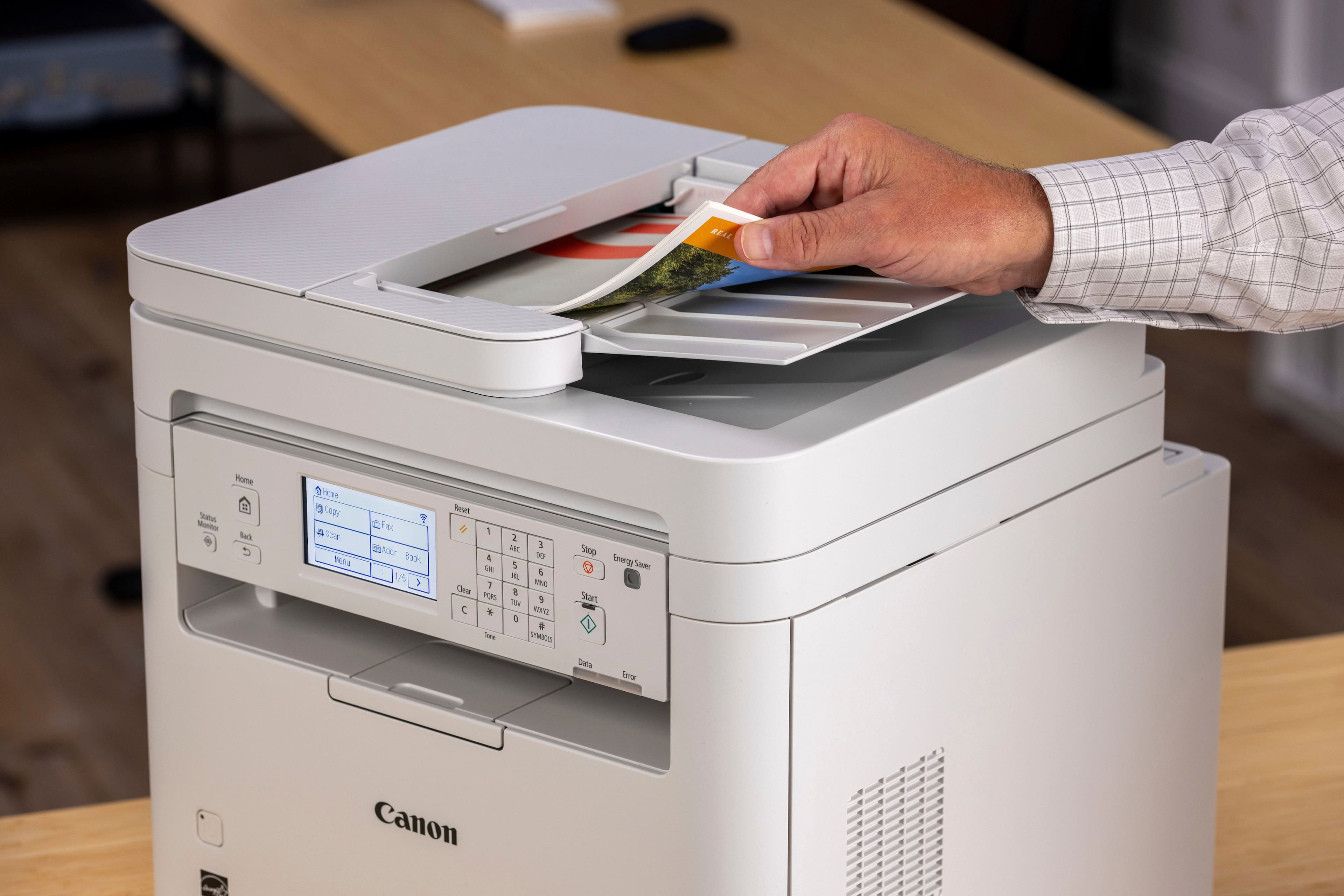 The text on the image reads: "Real Home Status Monitor -R (90) See Menu u F e kddr Book 15 Renet 1 & S 1 Ceta FORS K Ture 2 NE E TE7 5 6 MIND & 0 9 WETE a TMRL Stop Eegy Sauer Start Dalla beor Canon."