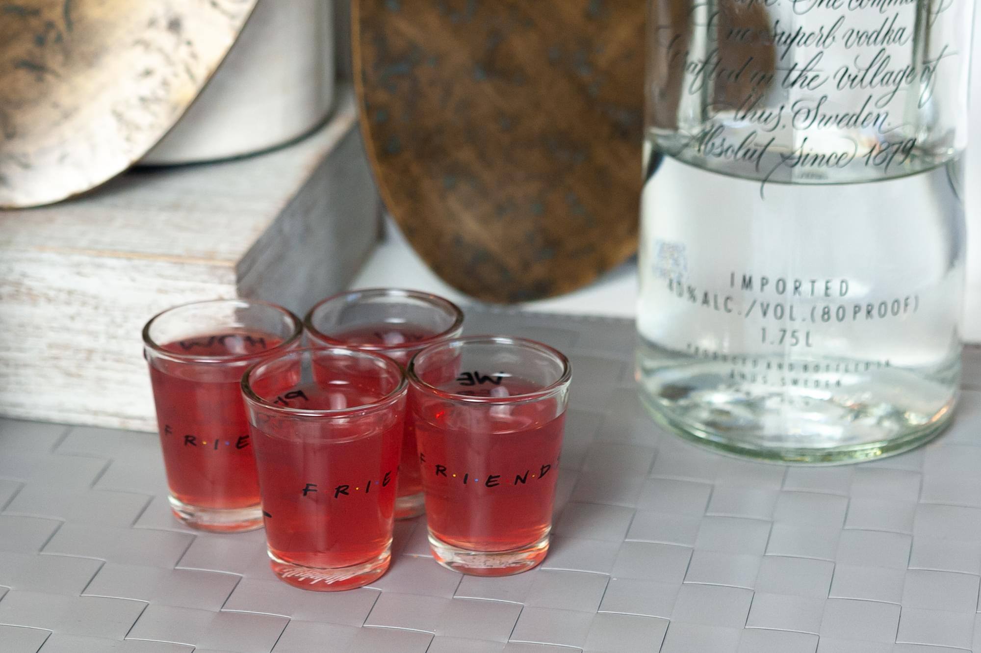 The corrected text from the image is:

---

The company  
that produces superb vodka  
crafted in the village  
of Åhus, Sweden  
Absolut Since 1879

IMPORTED  
40% ALC./VOL. (80 PROOF)  
1.75L  
DISTILLED AND BOTTLED  
IN ÅHUS, SWEDEN

---

FRIEND  
FRIEND  
FRIEND