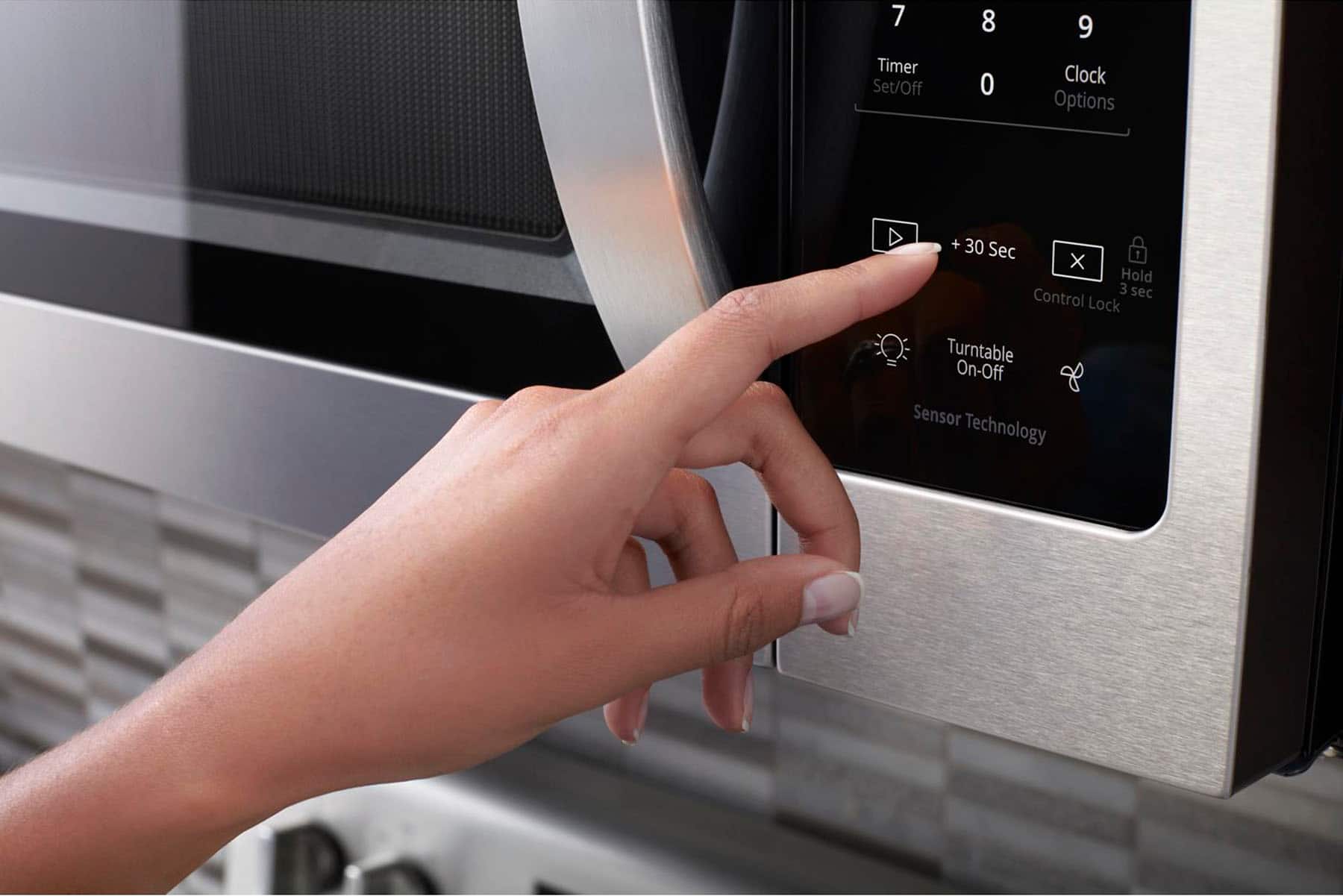 The text on the image reads: 2:20 Popcorn Potato Pizza Cook Reheat Soften/Melt Cook Time Cook Power Defrost 1 2 4 3 5 6 8 Timer Serve 9 0 Clock.