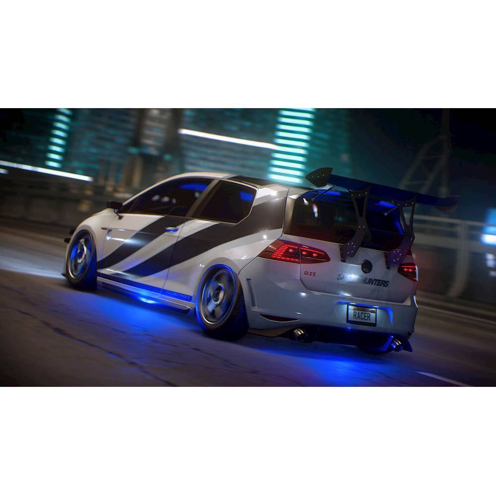 The image features a white car with a blue and black racing wing on the back, driving down a street at night. The car appears to be a GTI, and it is likely an unders racer, as indicated by the racing wing. The car is moving quickly, and the scene is set at night, which adds to the overall atmosphere of the image. - T (Teen 13+)