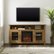 Alt View Zoom 12. Walker Edison - Tall Glass Two Door Soundbar Storage Fireplace TV Stand for Most TVs Up to 65" - Barnwood.