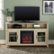 Alt View Zoom 1. Walker Edison - 58" Tall Glass Two Door Soundbar Storage Fireplace TV Stand for Most TVs Up to 65" - White Oak.
