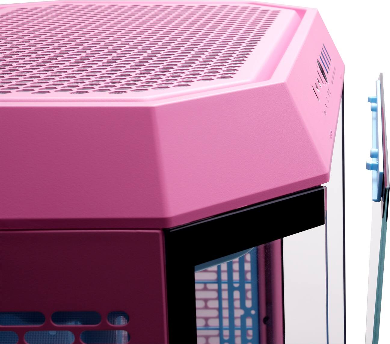 The image features a pink object, which appears to be a container or a piece of furniture. The object is placed on a white background, and there is a blue object nearby. The pink container has a unique design, with a brick pattern on its side.