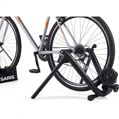 stationary bicycle stand Alpcour Bike Trainer for Indoor Riding Portable Foldable Magnetic Stainless Steel Indoor Trainer, Noise Reduction, 6 Resistance Settings & Bag Exercise for Road & Mountain Bikes letting you jump into virtual group rides Saris - Mag Trainer