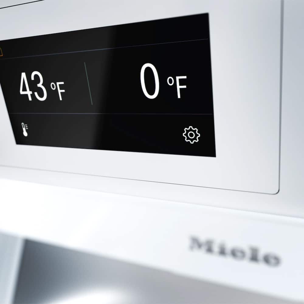 The text on the image reads "43F F 0E 0F F Miele." To group and correct the text, we can separate the temperature and brand information. The temperature is 43 degrees Fahrenheit, and the brand is Miele. The corrected text would be: "43°F Miele."