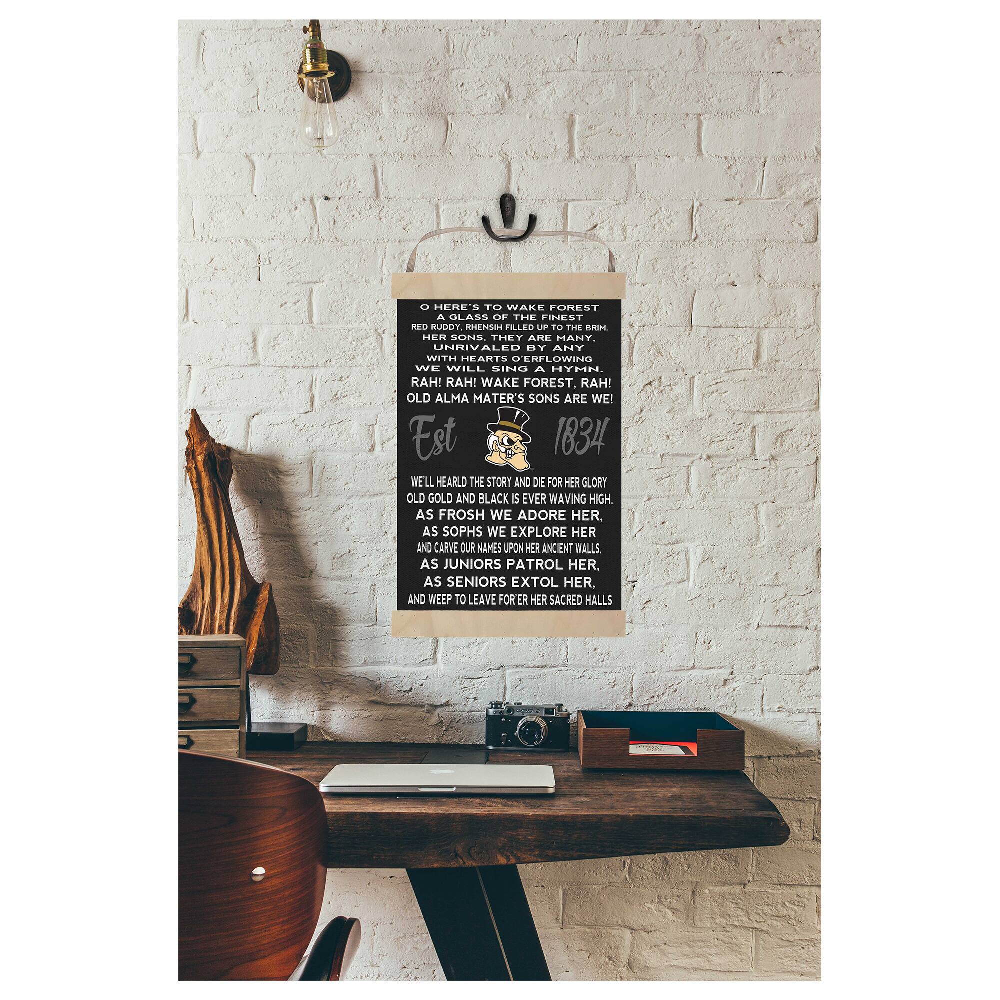 O HERE'S TO WAKE FOREST  
A GLASS OF THE FINEST DEO  
TOUM  
n2 FLLTO U  
TO THE dRs DIER SONS  
THEY ARE MANY.  
UHRIVALED ET ANY  
WITH HEARTS DERFLOWING  
WE WILL SING A HYMN.  
RAH! RAH! WAKE FOREST, RAH!  
OLD ALMA MATER'S SONS ARE WE  
Est 1834  
WE'LL HEARLD THE STORY AND DIE FOR HER GLORY  
OLD GOLD AND BLACK  
5 EVER WAVING HIGH  
AS FROSH WE ADORE HER,  
AS SOPHS WE EXPLORE HER  
AND CARVE OUR NAMES UPON HER ANCIENT WALLS  
AS JUNIORS PATROL HER.  
AS SENIORS EXTOL HER,  
AND WEEP TO LEAVE FORER HER SACRED HALLS