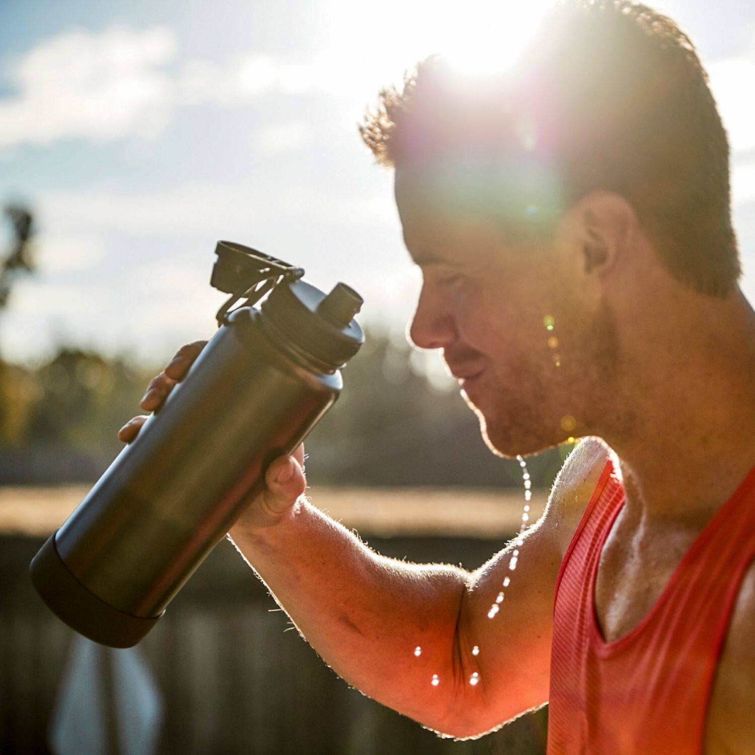 Left. Takeya - Actives 40oz Spout Bottle - Slate.