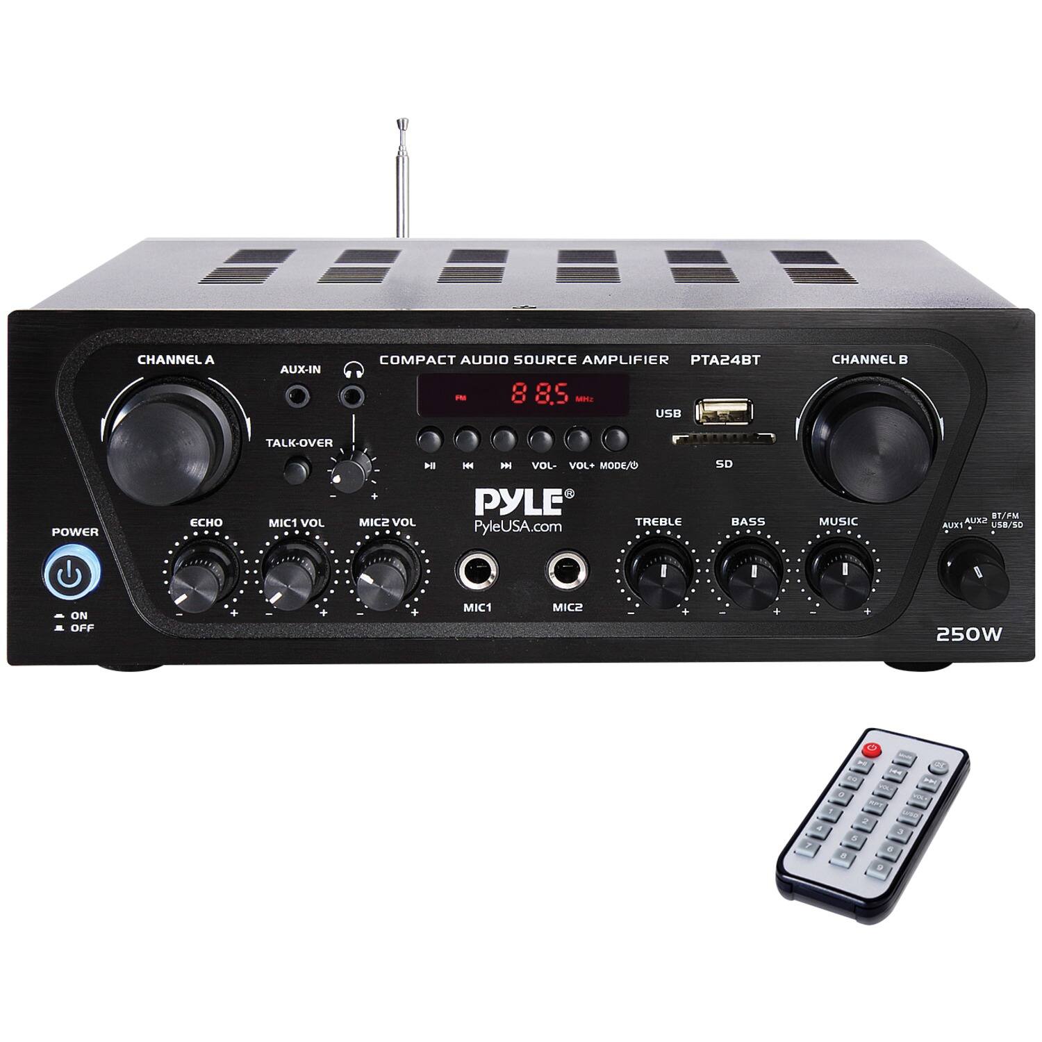 The image features a Pyle compact audio source amplifier with a remote control sitting next to it. The amplifier has various controls, including a talk-over power, echo, and music/FM settings. The amplifier is designed to provide 250 watts of power and is compatible with USB and SD cards. The remote control allows for easy adjustment of the amplifier's settings without needing to physically interact with the device.