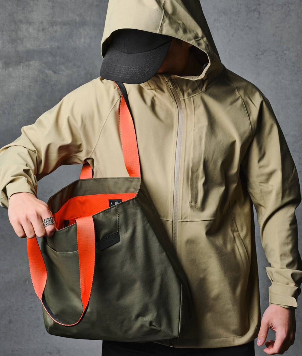 Left. ALPAKA - Elements Tote Bag 14.5L Weatherproof Foldable Travel Tote with Magnetic Closure - Green Axoflux 210D.